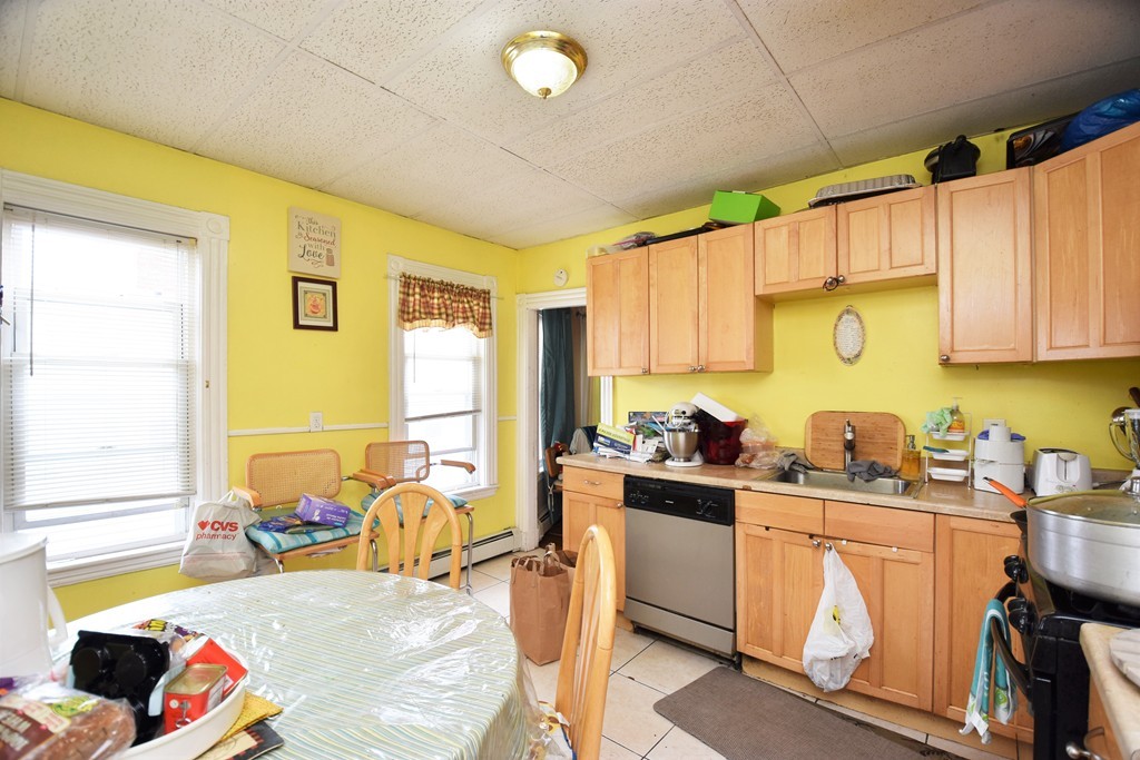 84 Vernal Street Everett, MA 02149 - Photo 8 of 26 a bed room with a bed and furniture