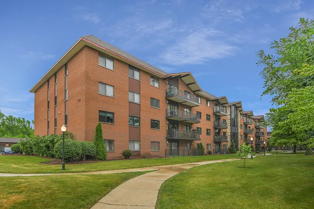 a view of a building with a yard
