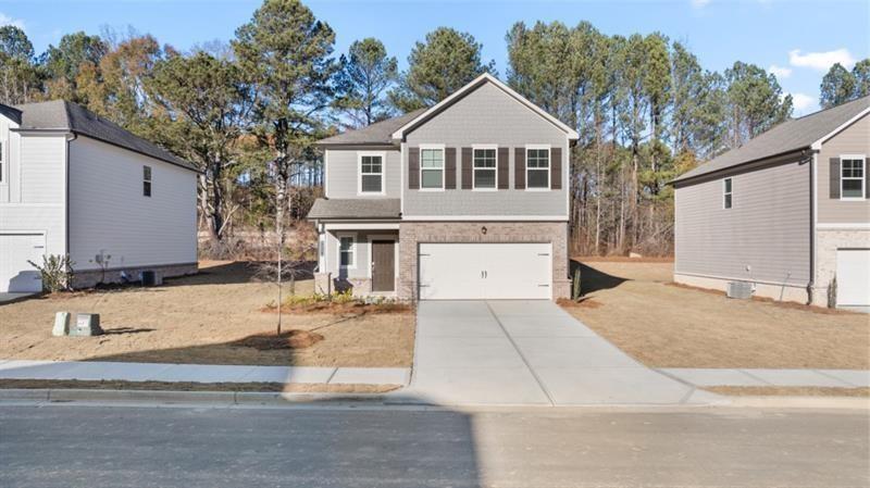 a front view of a house with a yard