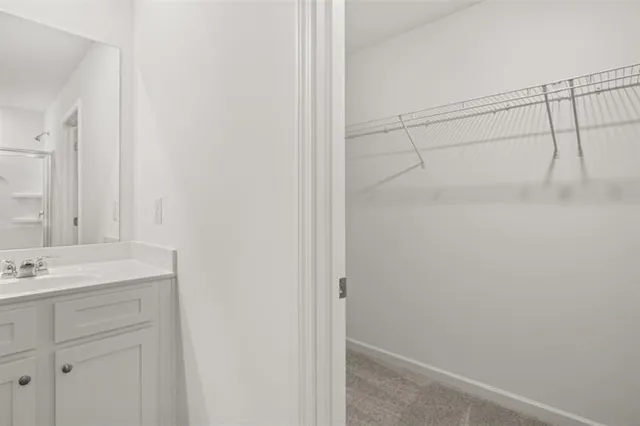 a bathroom with a sink and vanity