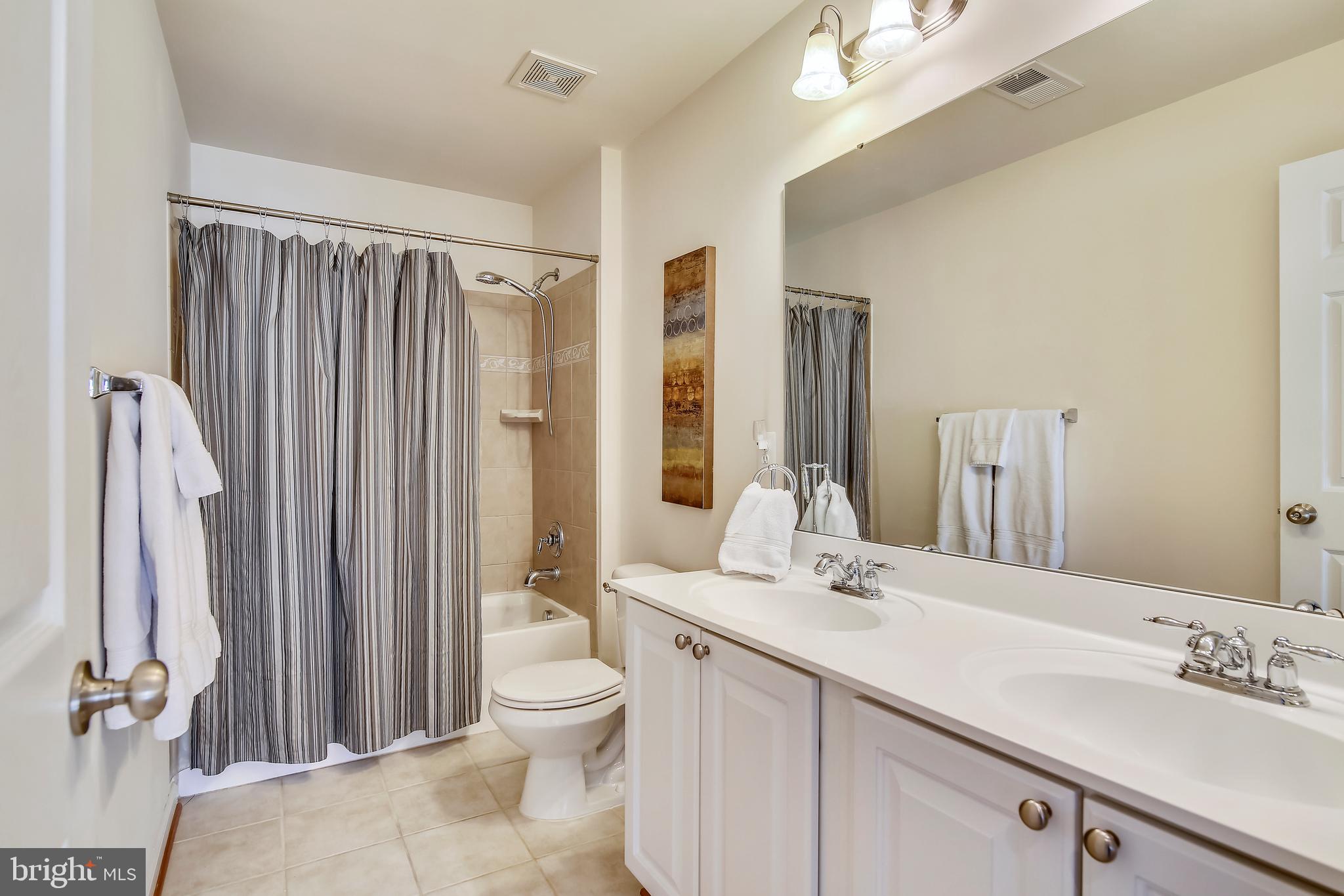 4537 Spring Run Road Warrenton, VA 20187 - Photo 40 of 68 Hall bath, dual sinks, upgraded tile w/border