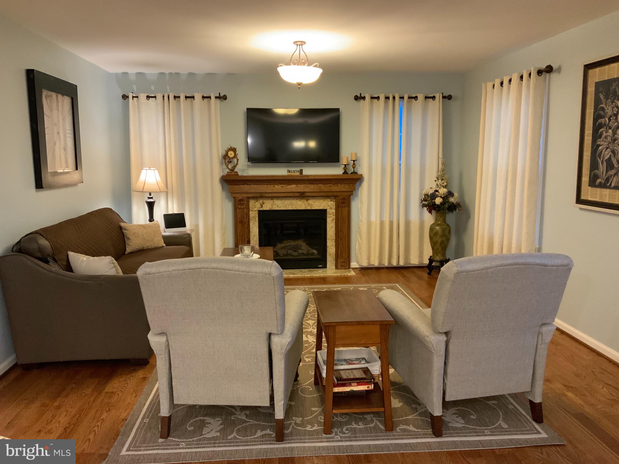 123 Reprisal Road Inwood, WV 25428 - Photo 17 of 64 Living Room-Hardwood Floors, Gas FP w/ Mantel