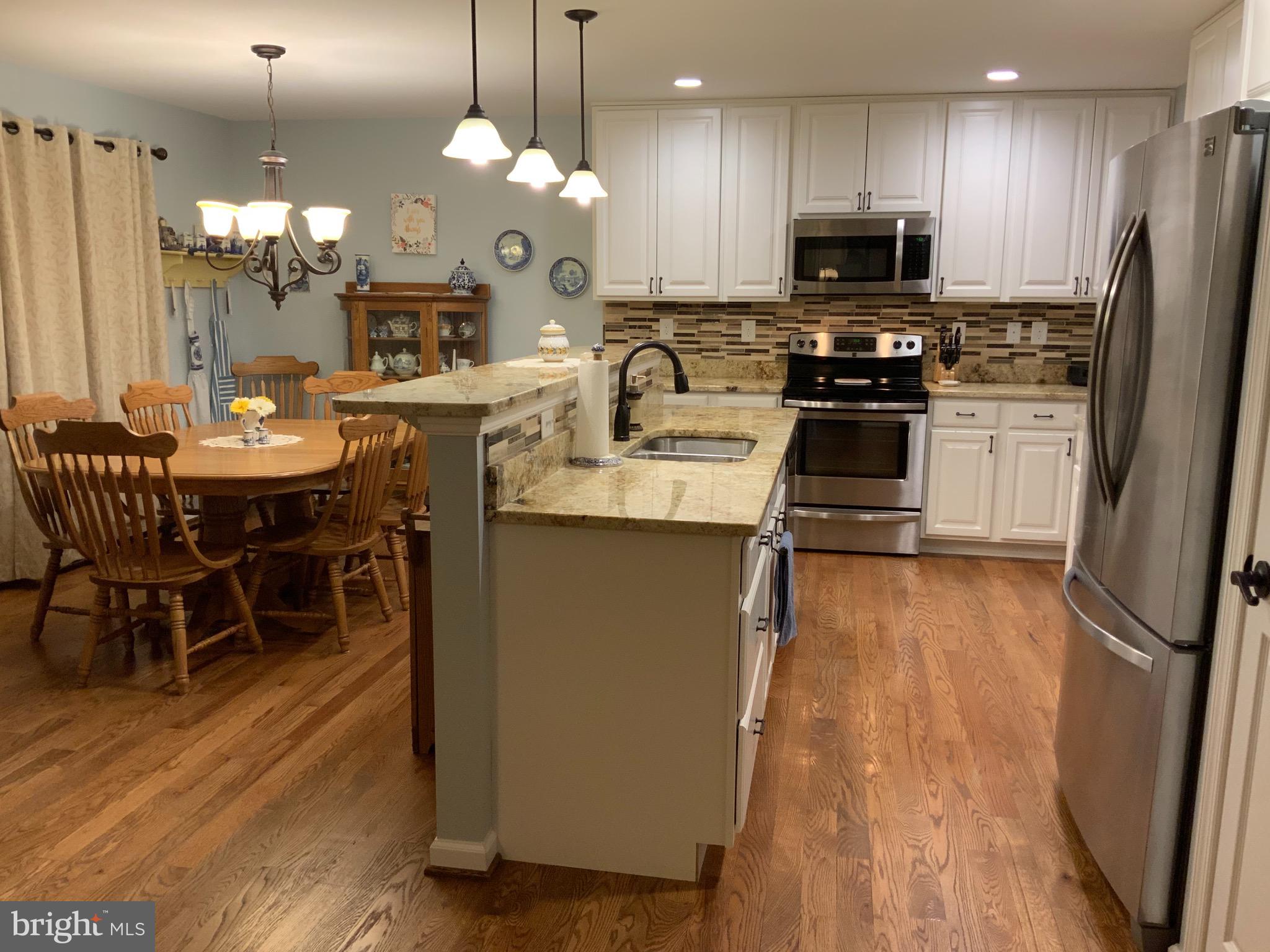 123 Reprisal Road Inwood, WV 25428 - Photo 5 of 64 Upgraded Cabinetry/Granite Counters/Tile Back Spla