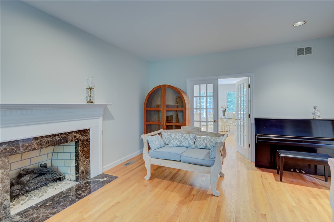 137 Signal Ridge Way East Greenwich, RI 02818 - Photo 14 of 50 Gas Fireplace. French door to Sun room