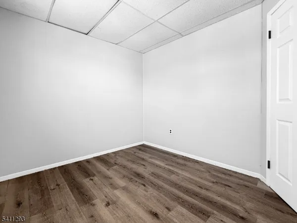 an empty room with wooden floor