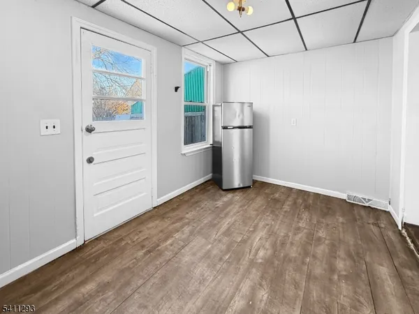 a view of empty room with cabinet