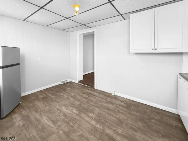 a view of a storage & utility room with wooden floor