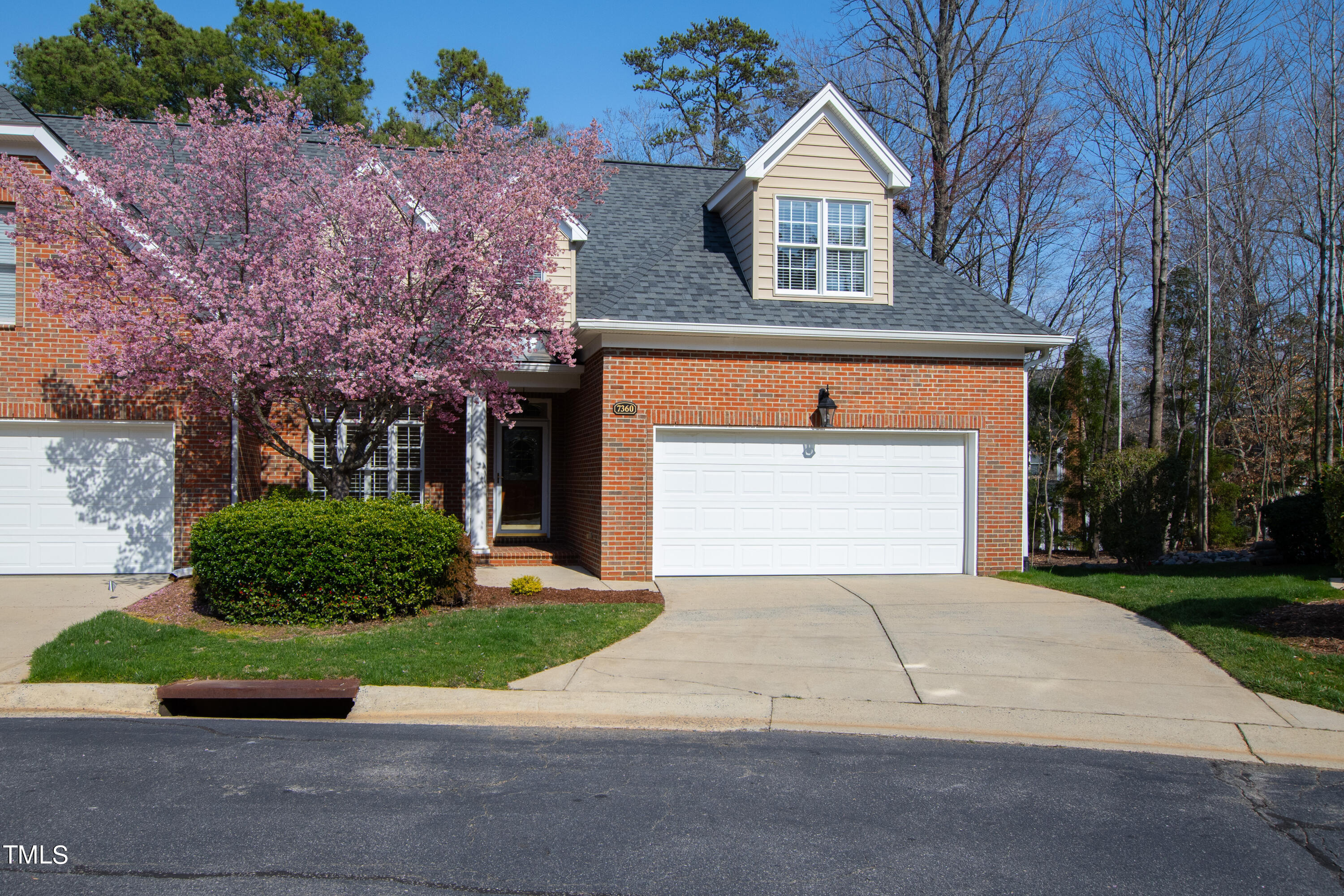 7360 Fontana Ridge Lane Raleigh, NC 27613 - Photo 1 of 48 a front view of a house with a yard and garage