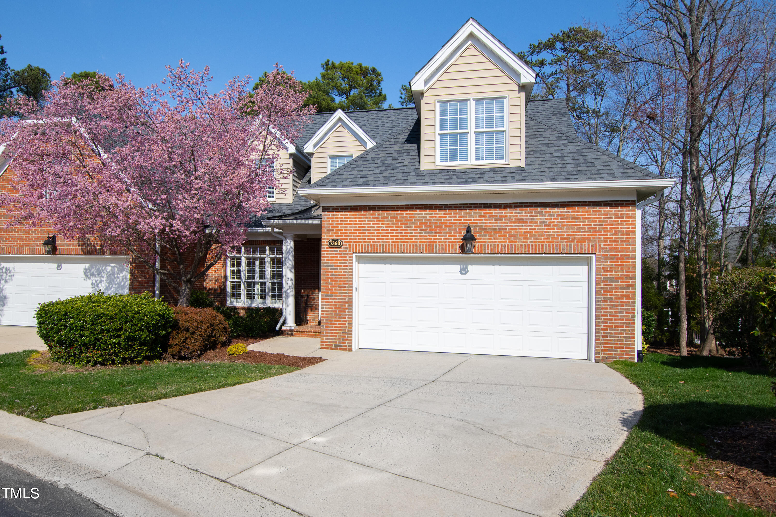7360 Fontana Ridge Lane Raleigh, NC 27613 - Photo 8 of 48 a front view of a house with a yard and garage
