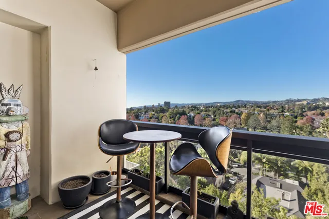a spacious bedroom with a bed and a large window