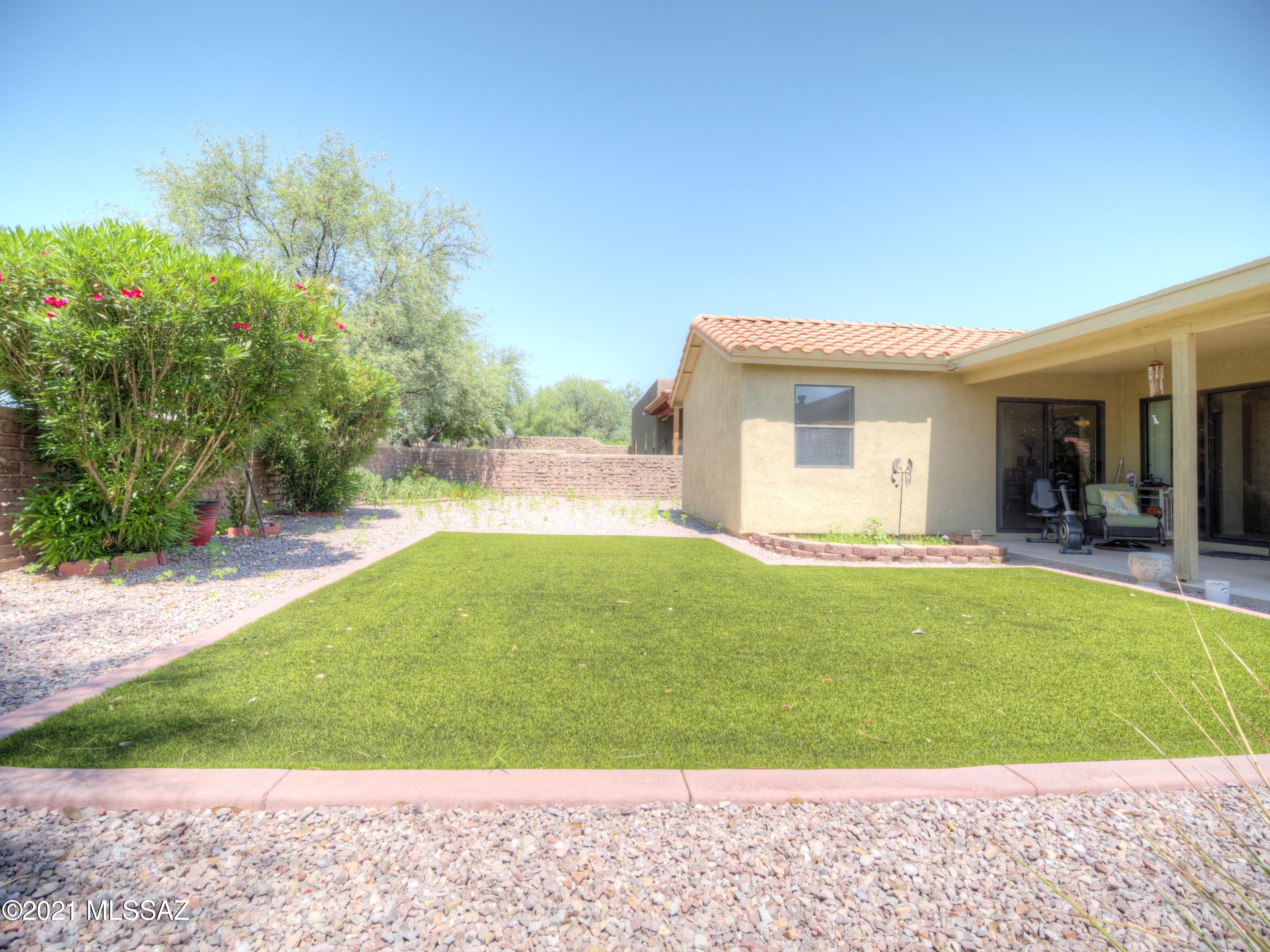 434 Colorado Court Rio Rico, AZ 85648 - Photo 27 of 29 a view of an house with backyard porch and garden