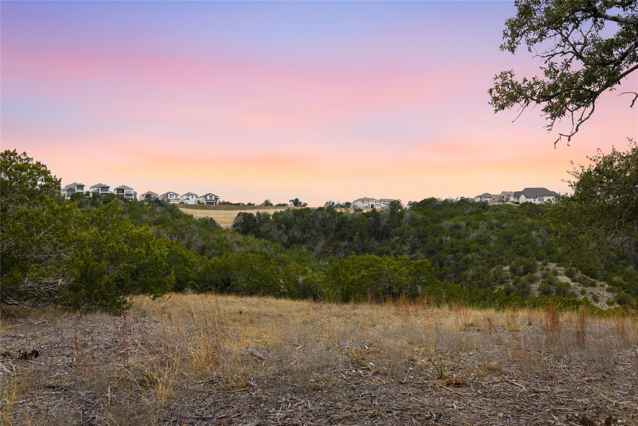 6204 Madrone Tree Lane Austin, TX 78738 - Photo 2 of 14 a view of a lake with a mountain in the background