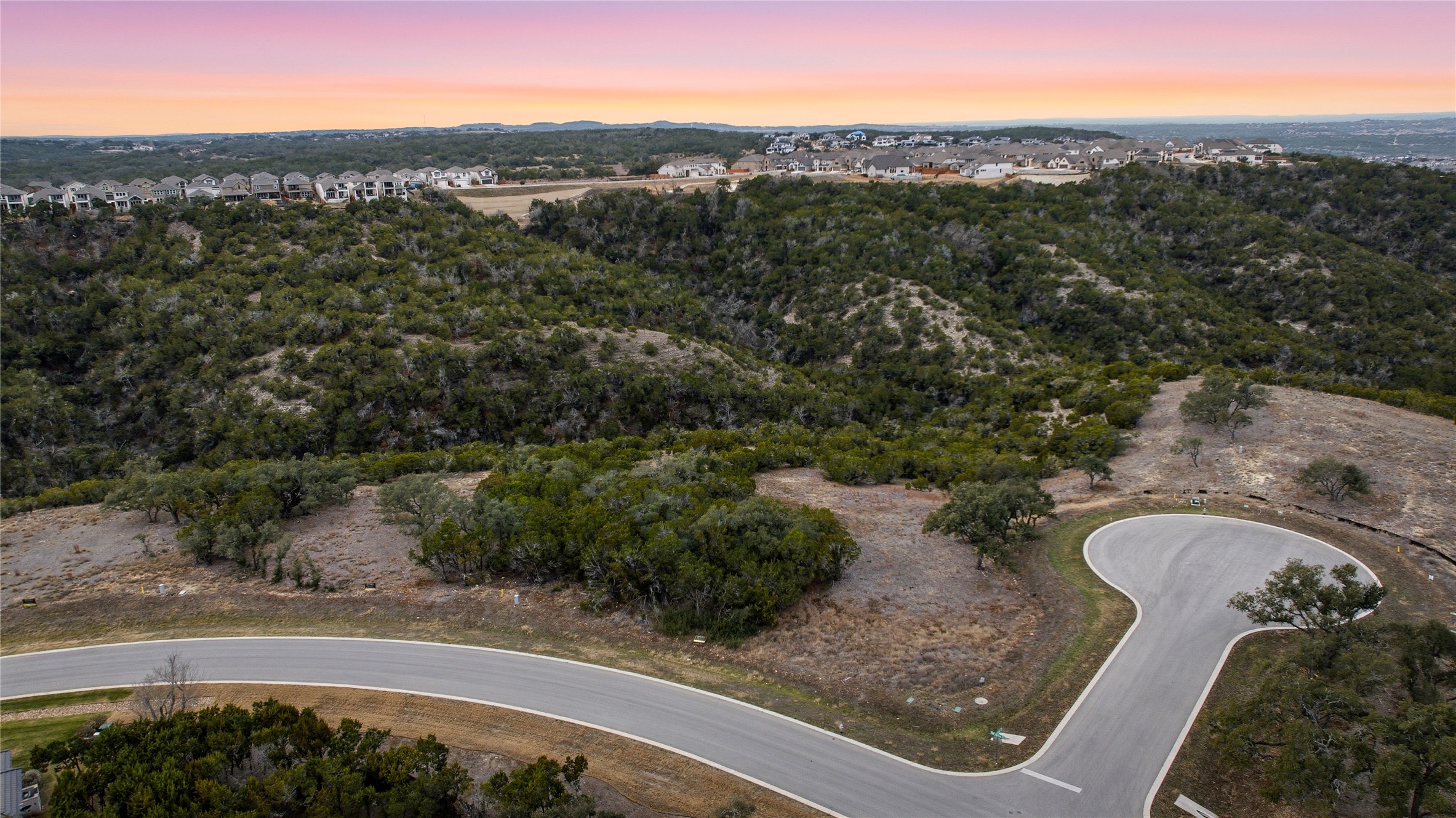 6204 Madrone Tree Lane Austin, TX 78738 - Photo 7 of 14 an aerial view of a house with a yard basket ball court and outdoor seating