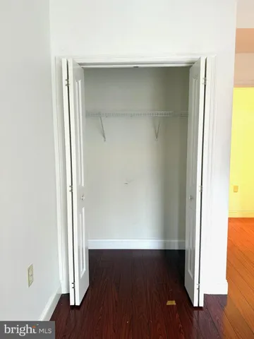 a view of front door with wooden floor