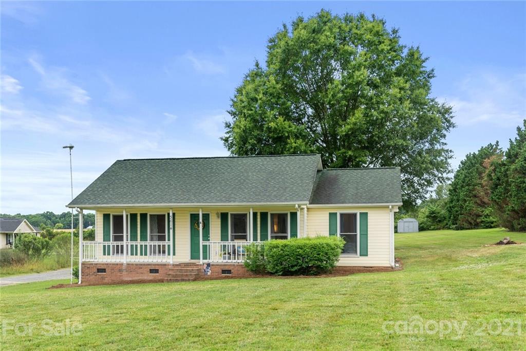 3614 White Store Road, Unit 5 Wingate, NC 28174 - Photo 2 of 21 a view of a house with a yard