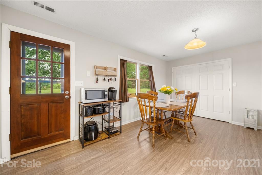 3614 White Store Road, Unit 5 Wingate, NC 28174 - Photo 11 of 21 a view of a dining room with furniture and a window