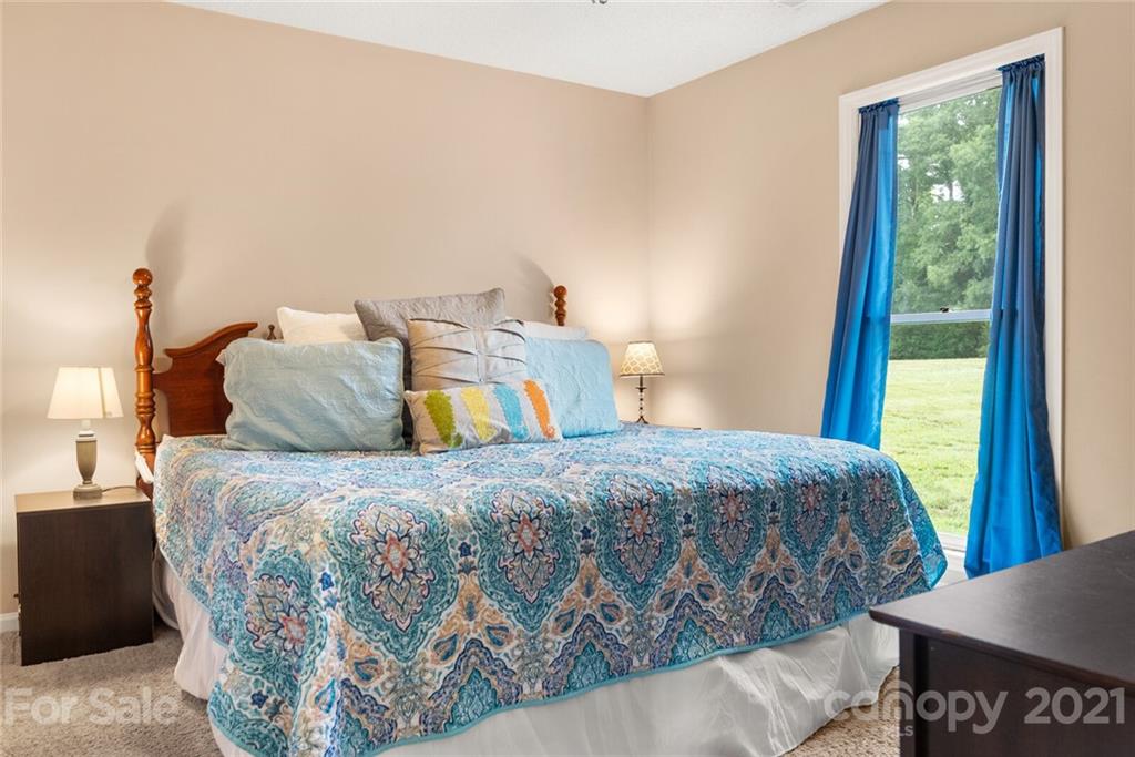 3614 White Store Road, Unit 5 Wingate, NC 28174 - Photo 12 of 21 a bedroom with a bed and a window