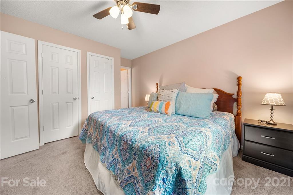 3614 White Store Road, Unit 5 Wingate, NC 28174 - Photo 13 of 21 a bedroom with a bed and a lamp