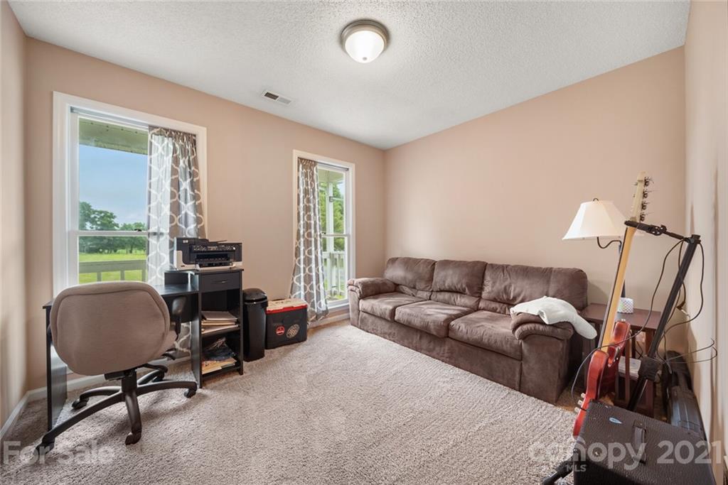 3614 White Store Road, Unit 5 Wingate, NC 28174 - Photo 15 of 21 a living room with furniture rug and a window