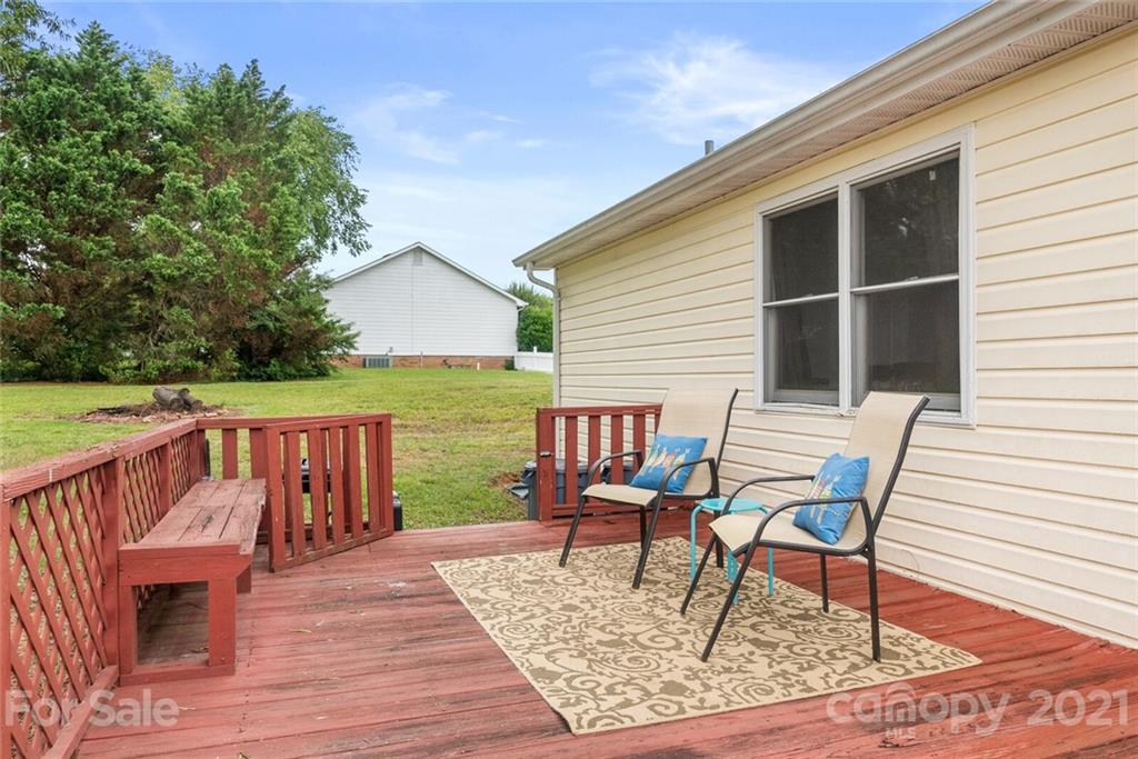 3614 White Store Road, Unit 5 Wingate, NC 28174 - Photo 18 of 21 a view of a chairs and table on the wooden floor