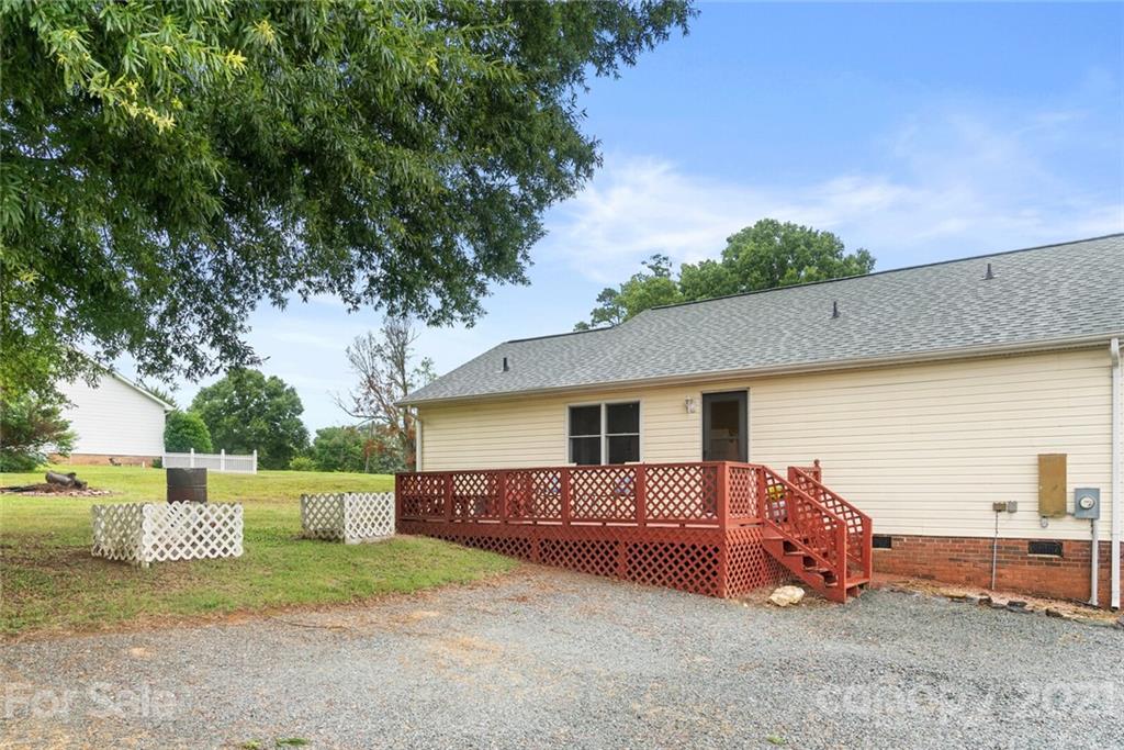 3614 White Store Road, Unit 5 Wingate, NC 28174 - Photo 19 of 21 a view of a house with a yard
