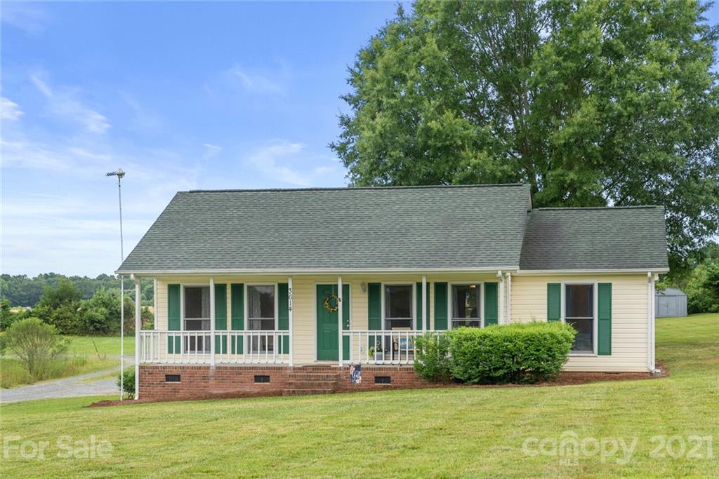 3614 White Store Road, Unit 5 Wingate, NC 28174 - Photo 3 of 21 a front view of a house with a yard