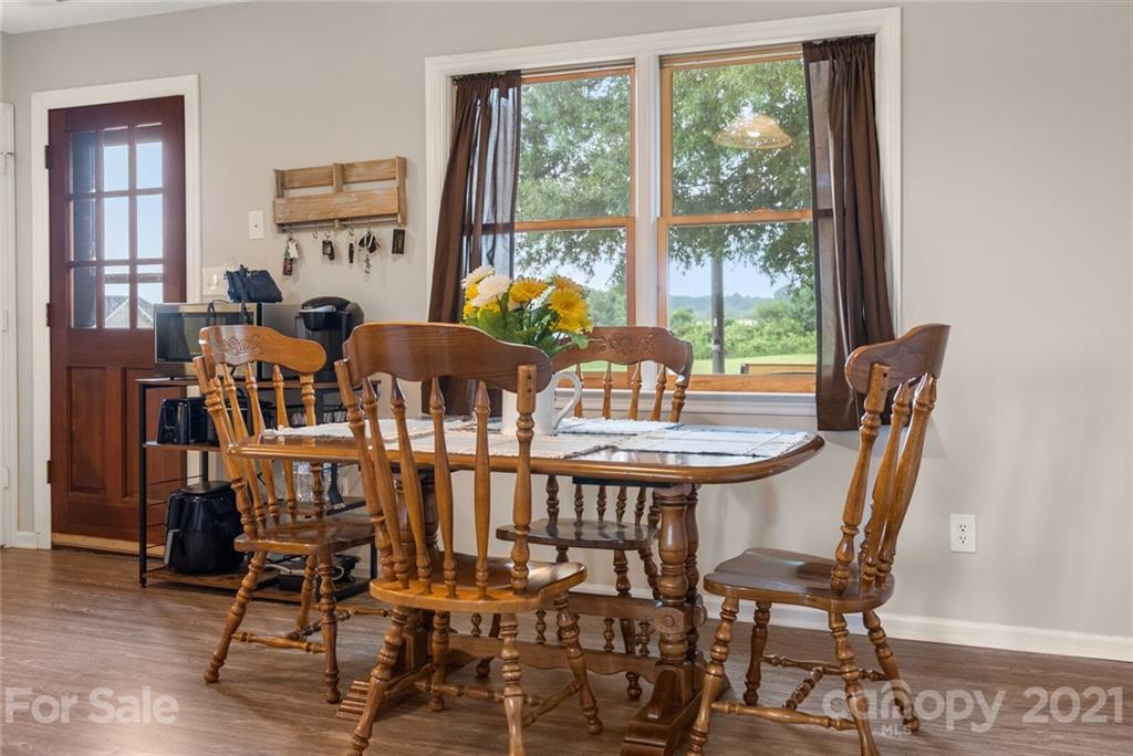 3614 White Store Road, Unit 5 Wingate, NC 28174 - Photo 9 of 21 a view of a dining room with furniture window and wooden floor
