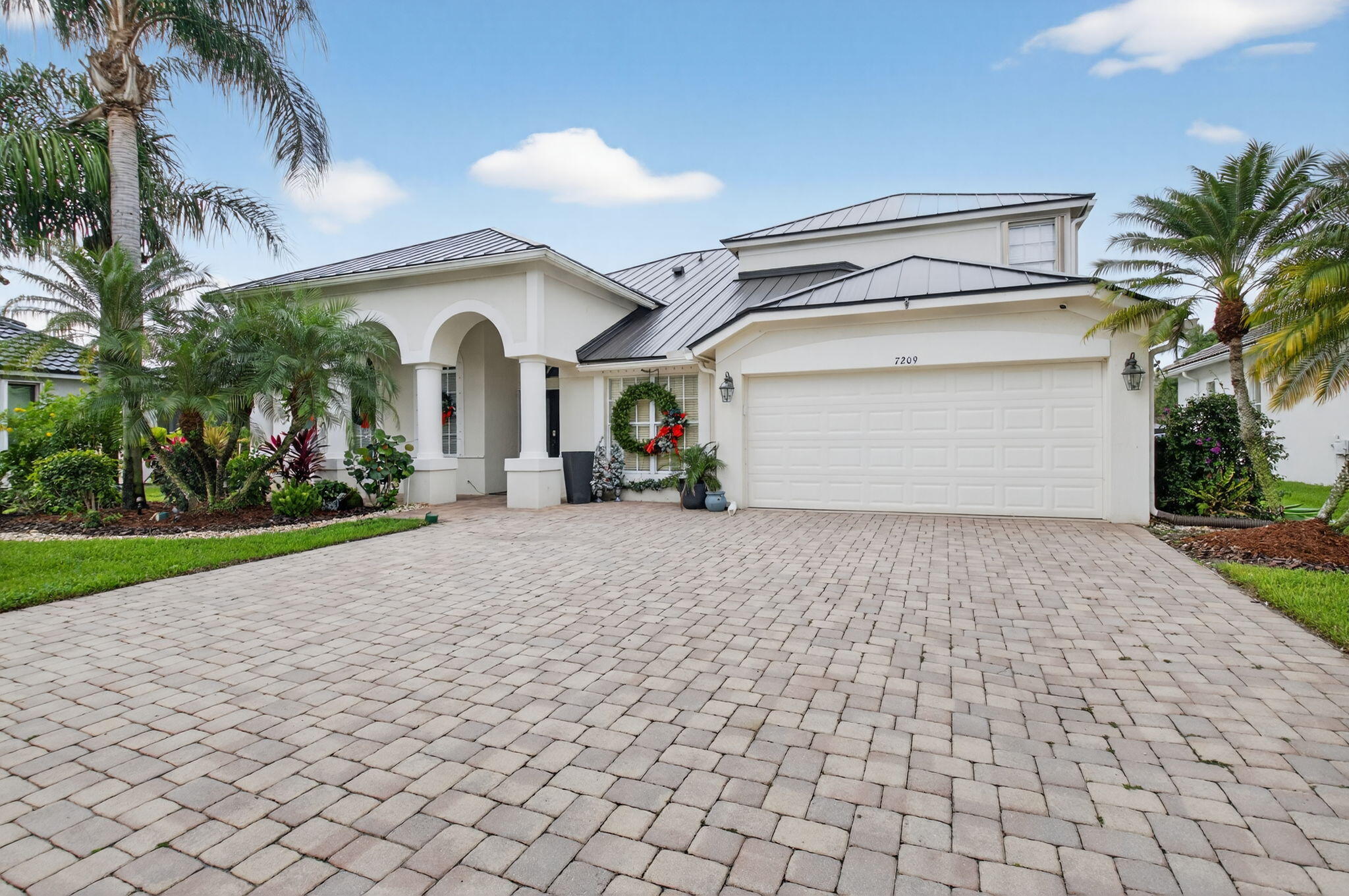 7209 Serrano Terrace Delray Beach, FL 33446 - Photo 2 of 48 a view of entryway and hall with wooden floor