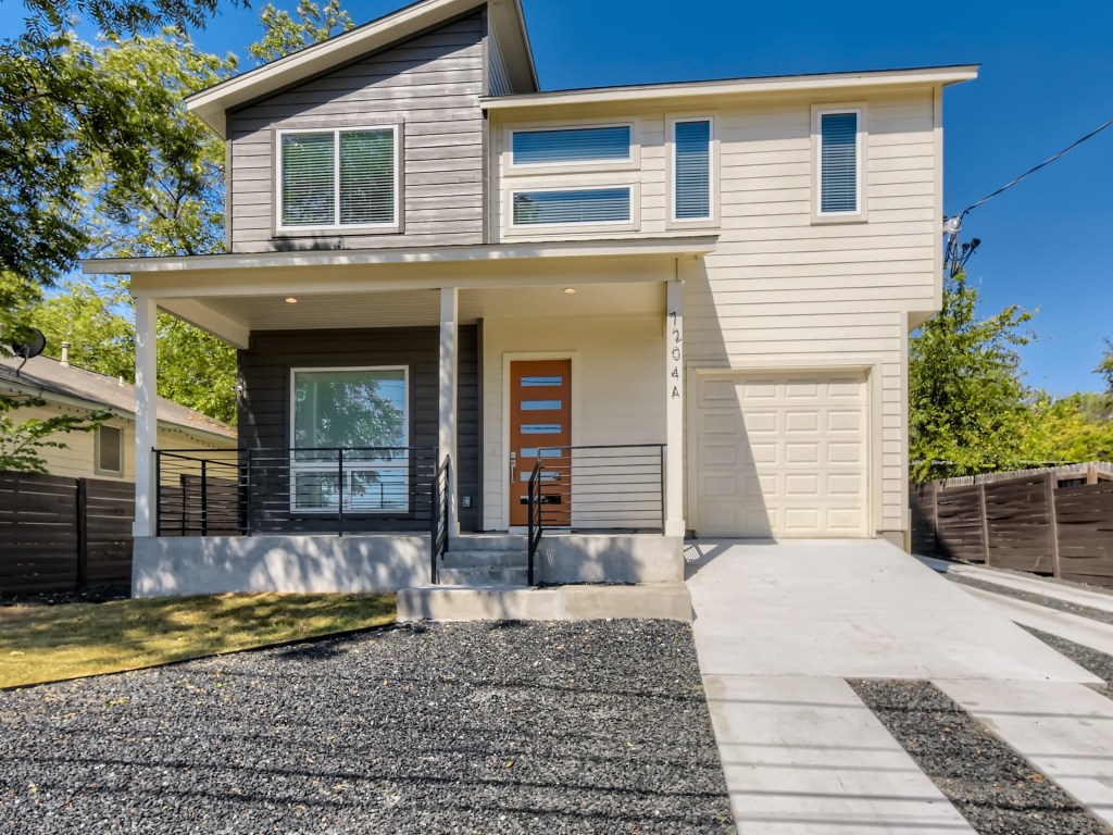a front view of a house with a yard and window
