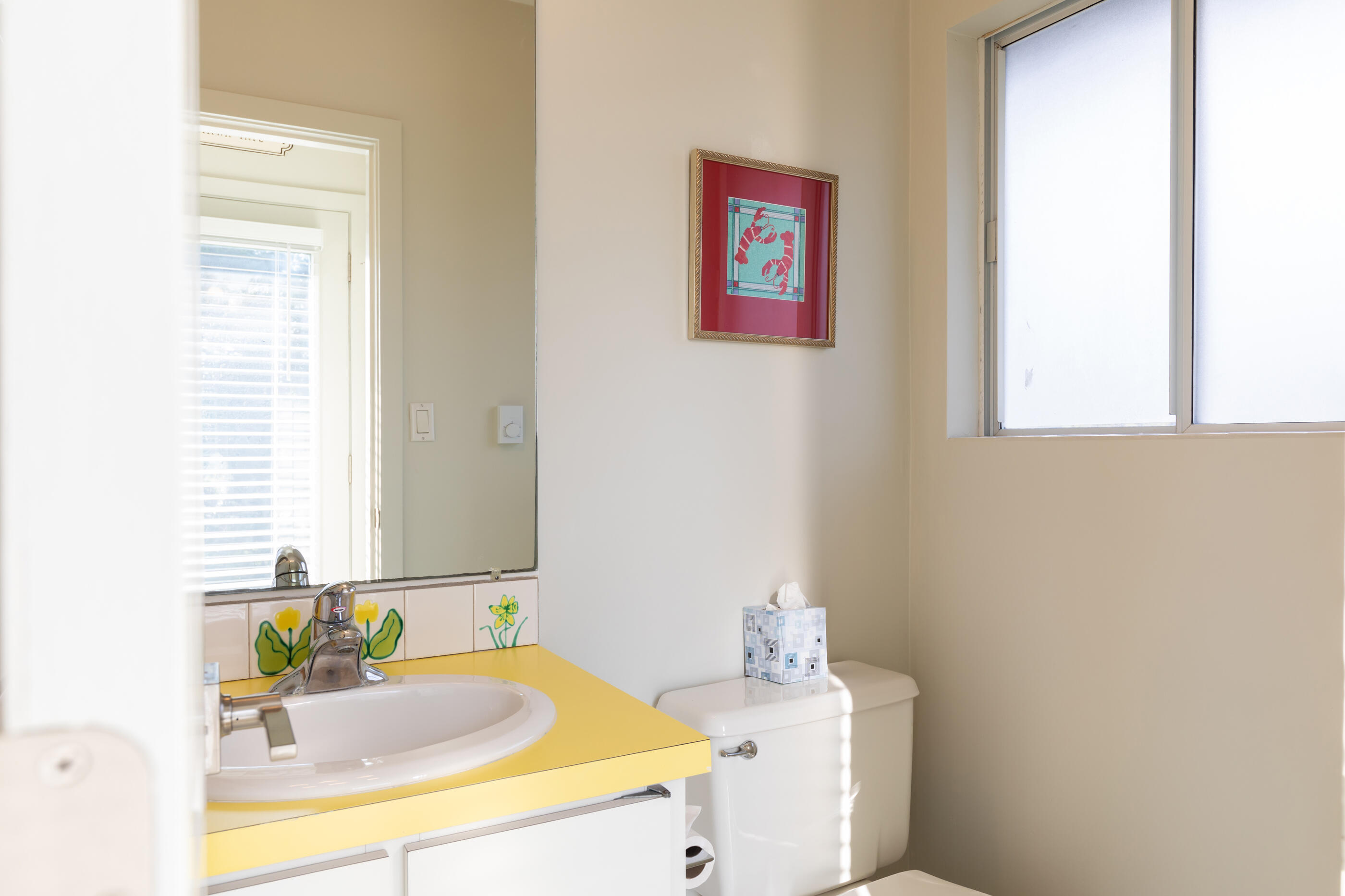 20 Beach Road Eastham, MA 02642 - Photo 18 of 23 a bathroom with a sink and a mirror