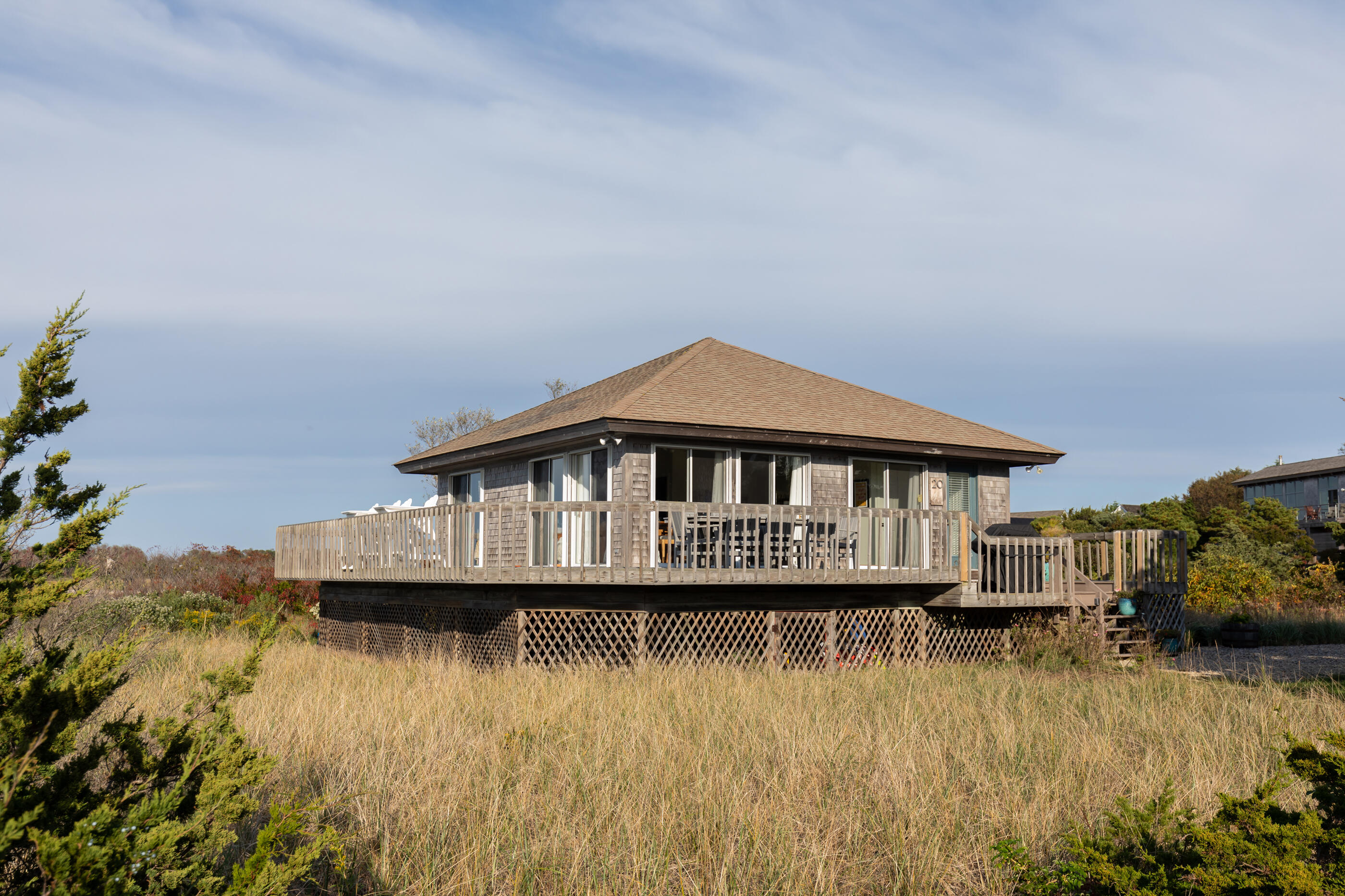 20 Beach Road Eastham, MA 02642 - Photo 4 of 23 a front view of a house with a boat