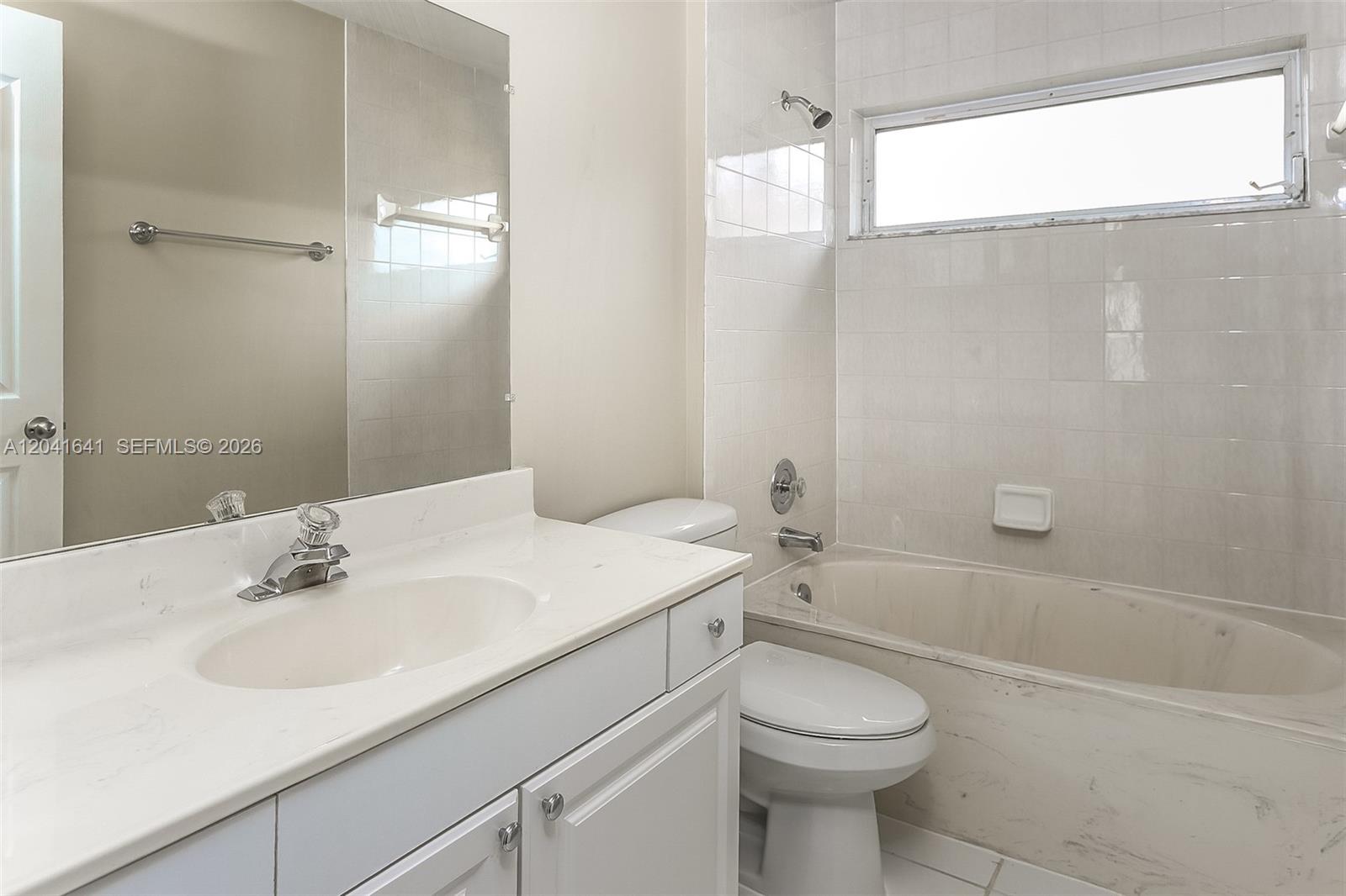 6484 Robinson Street Jupiter, FL 33458 - Photo 11 of 15 a bathroom with a sink toilet and shower