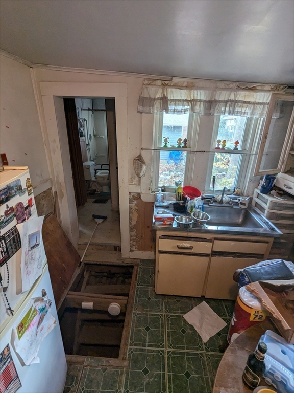 14 Washington Avenue Ashland, MA 01721 - Photo 17 of 23 a kitchen with stainless steel appliances granite countertop a stove a refrigerator and a dining table