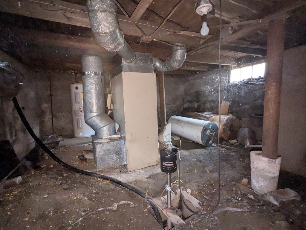 14 Washington Avenue Ashland, MA 01721 - Photo 22 of 23 a room with water heater and a wooden floors