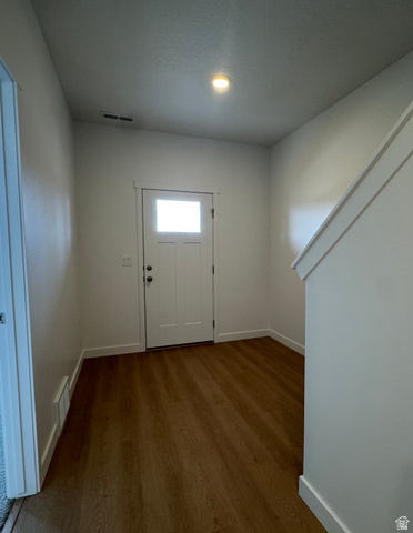 1876 West 1575th North, Unit 237 Layton, UT 84041 - Photo 2 of 20 Entryway featuring baseboards and dark wood finished floors