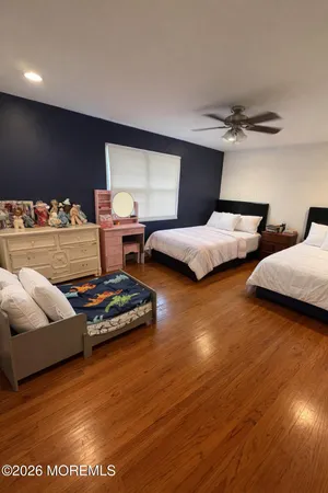 a bedroom with bed and window