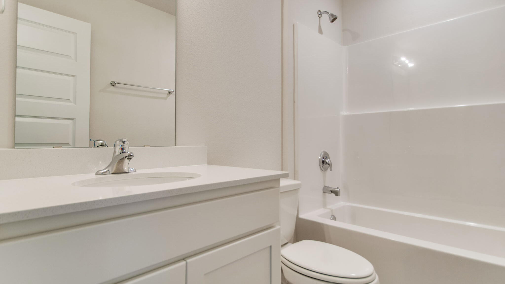 5620 Thatcher Road Crestview, FL 32539 - Photo 25 of 30 a bathroom with a bathtub shower sink vanity mirror and toilet