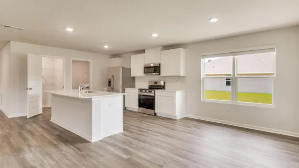 a kitchen with stainless steel appliances granite countertop a stove and a sink