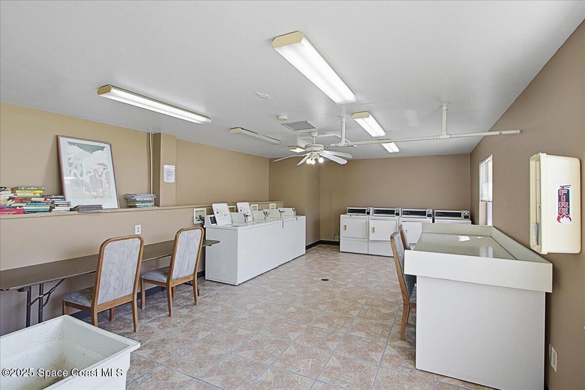 586 North Wickham Road, Unit 63 Melbourne, FL 32935 - Photo 55 of 83 a view of a storage & utility room with washer and dryer