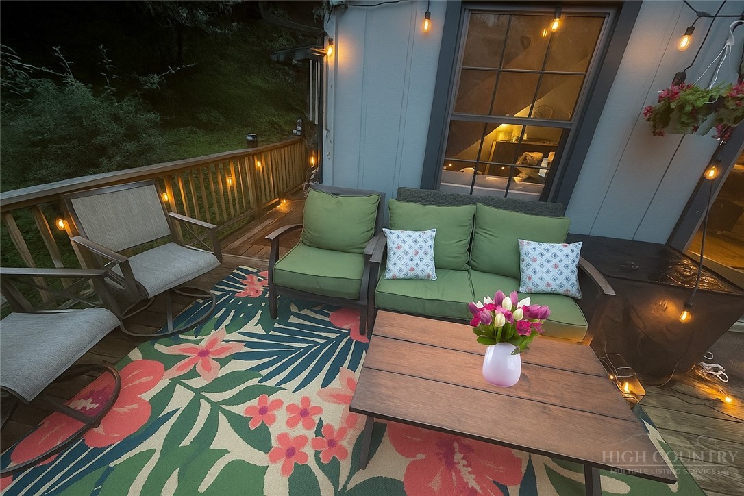 9440 Blackberry Road Lenoir, NC 28645 - Photo 23 of 30 a outdoor living space with furniture and flowers