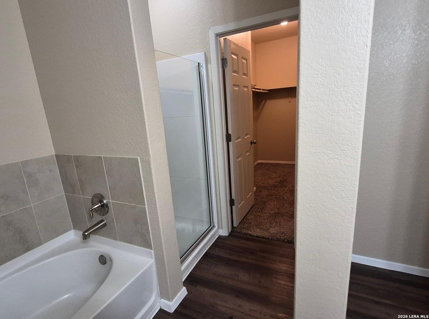 7102 Zuma Beach Converse, TX 78109 - Photo 19 of 31 a bathroom with a bathtub and a shower
