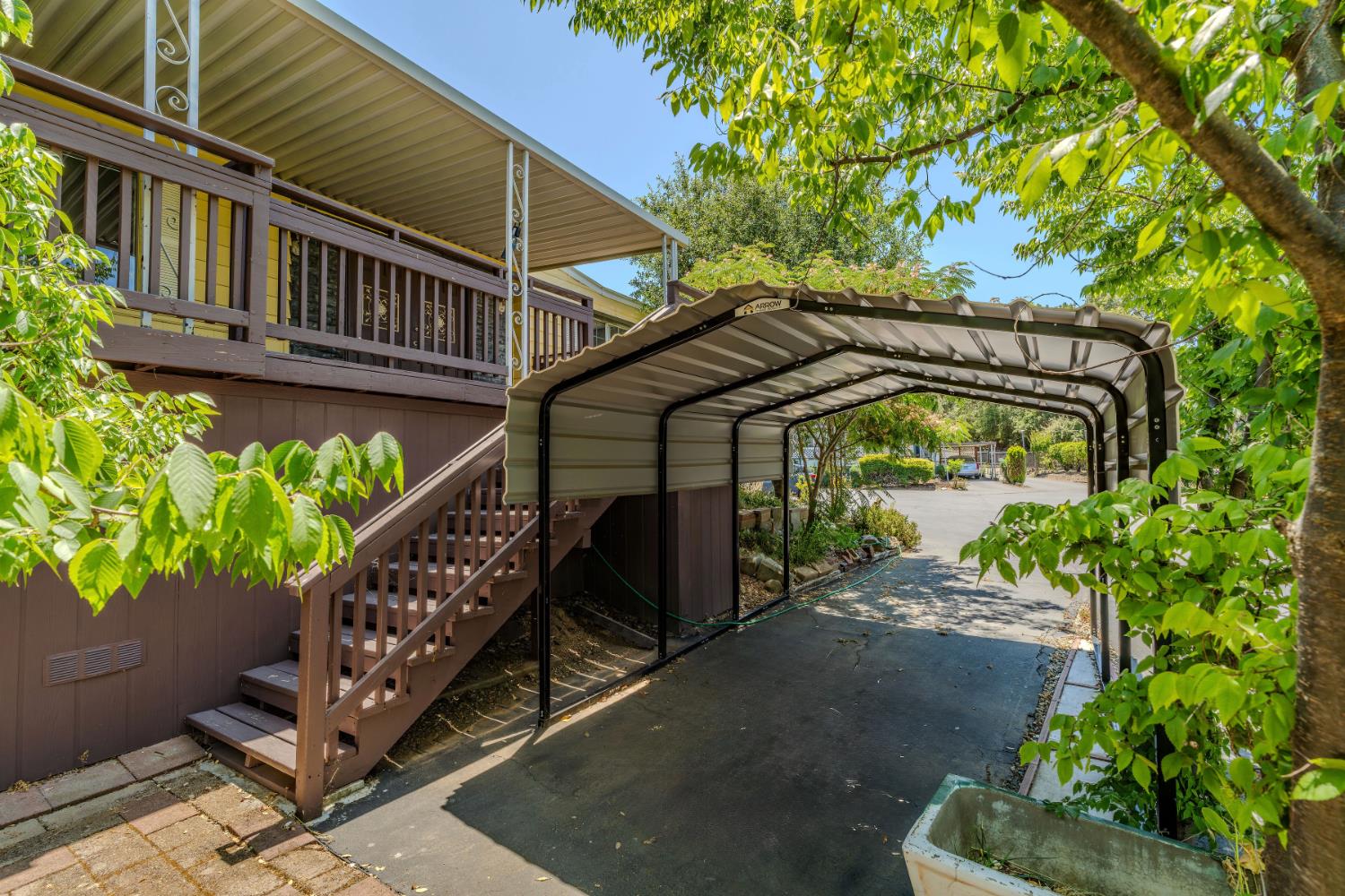 a view of stairs and a yard