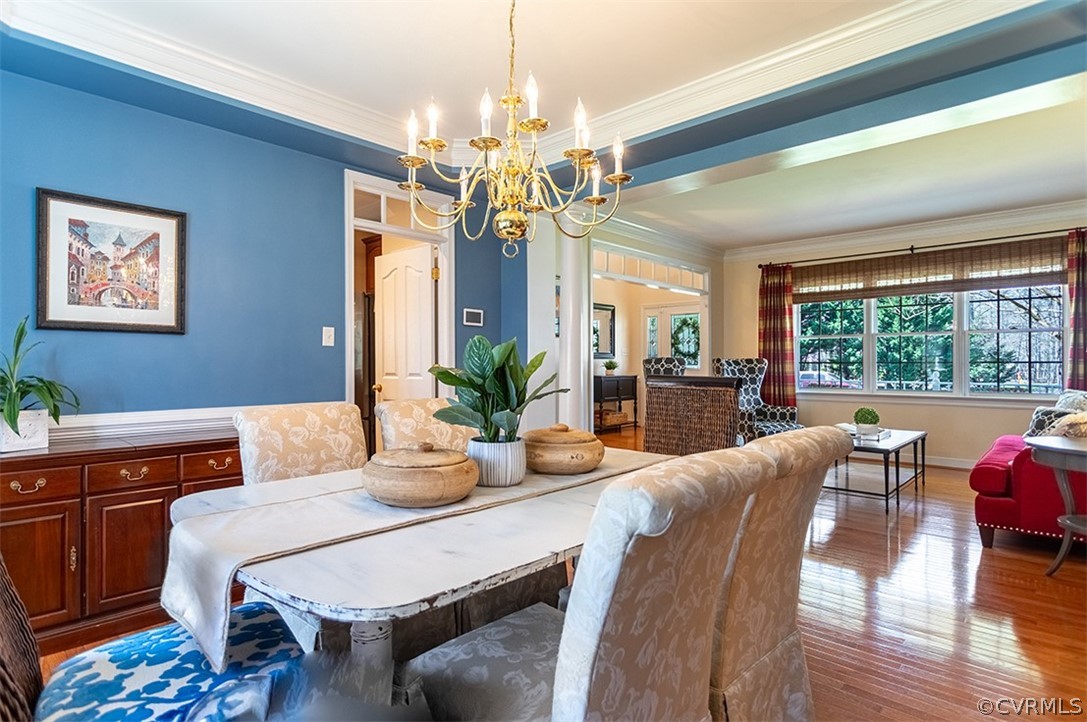 14006 Planters Walk Drive Midlothian, VA 23113 - Photo 12 of 48 a dining room with furniture a chandelier and wooden floor