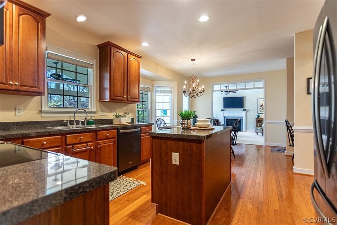 14006 Planters Walk Drive Midlothian, VA 23113 - Photo 13 of 48 a kitchen with stainless steel appliances granite countertop sink stove top oven and cabinets