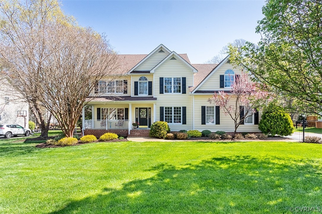 14006 Planters Walk Drive Midlothian, VA 23113 - Photo 2 of 48 a front view of a house with a yard and trees