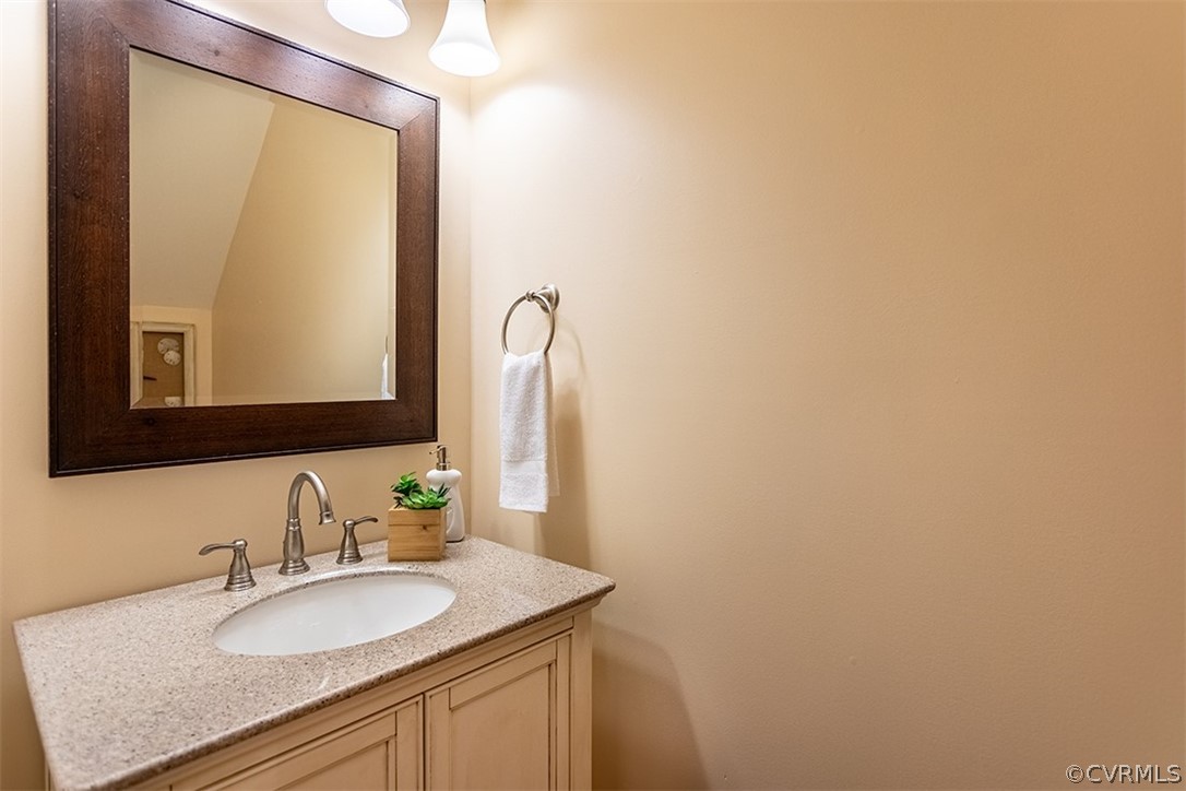 14006 Planters Walk Drive Midlothian, VA 23113 - Photo 22 of 48 a bathroom with a granite countertop sink and a mirror