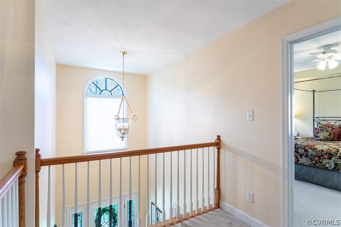 14006 Planters Walk Drive Midlothian, VA 23113 - Photo 24 of 48 a view of a hallway view with wooden floor and staircase