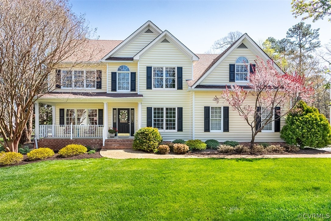 14006 Planters Walk Drive Midlothian, VA 23113 - Photo 3 of 48 a front view of a house with a yard and plants