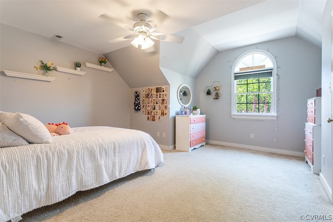 14006 Planters Walk Drive Midlothian, VA 23113 - Photo 32 of 48 a spacious bedroom with a bed and a chandelier
