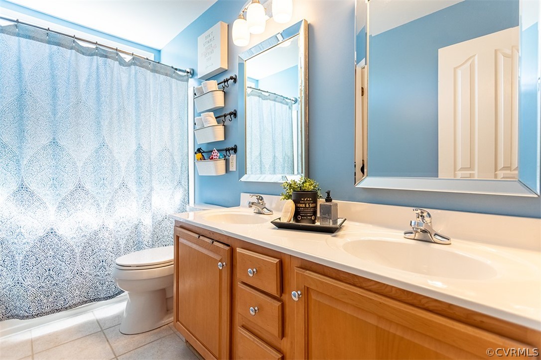 14006 Planters Walk Drive Midlothian, VA 23113 - Photo 33 of 48 a bathroom with a granite countertop sink a toilet and a mirror